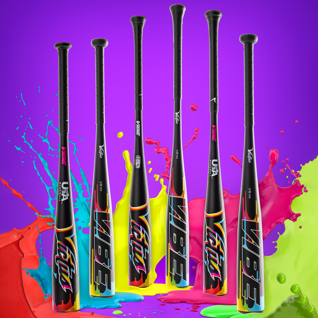 Six vibrant Victus Vibe (-8) 2 3/4" USSSA Baseball Bats (VSBVIB8) stand upright on a bright purple background, surrounded by splashes of red, green, yellow, and blue paint.