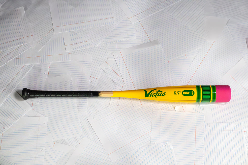 The Victus 2025 Vibe Pencil (-5) USSSA Baseball Bat features a playful yellow pencil design with a pink eraser, crafted from high-performance alloy for serious play and standout style.