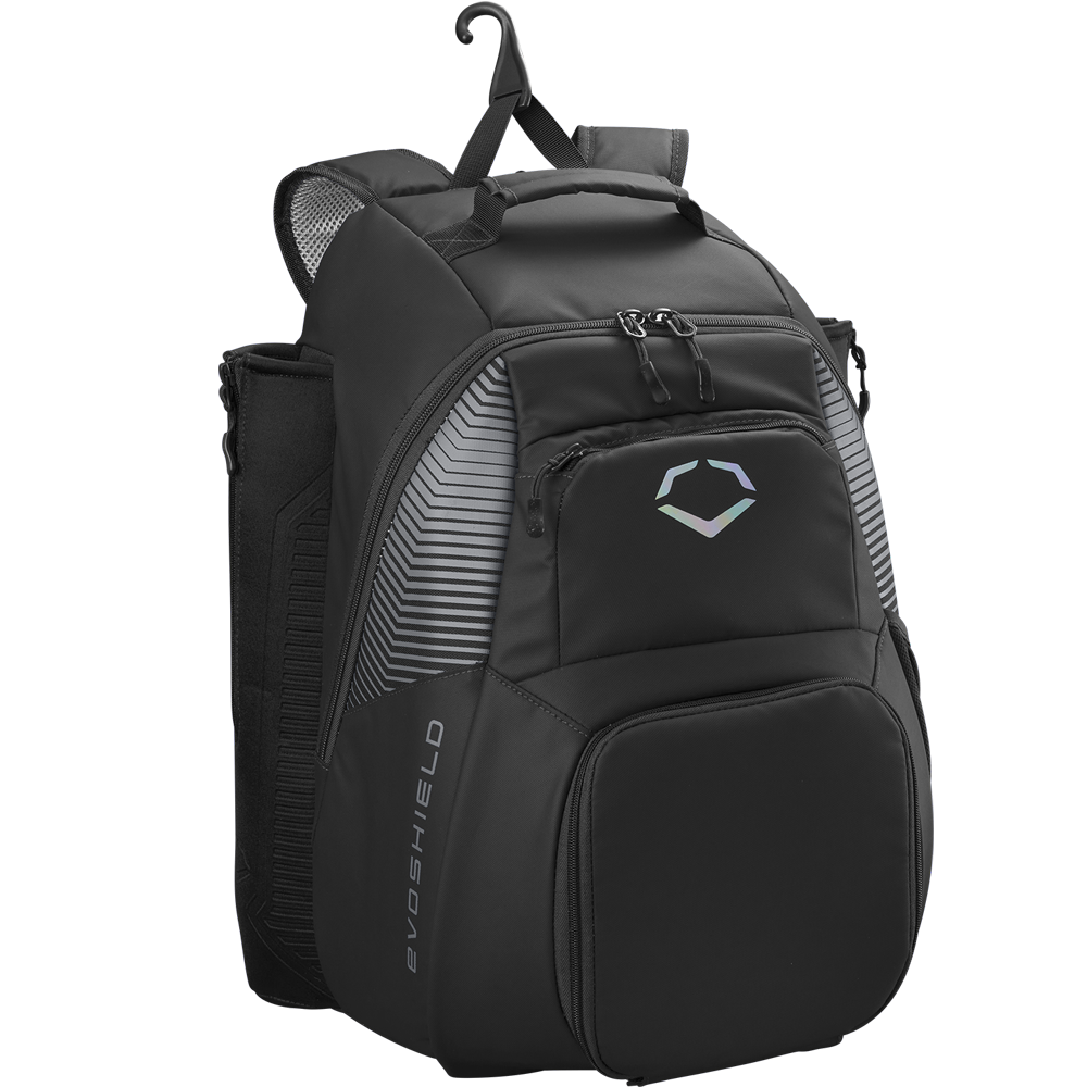 The EvoShield Tone Set Backpack (WB57304) is a black, water-resistant gear bag with multiple zippered compartments, padded shoulder straps, mesh side pockets, bat sleeves, a top hanging hook, and a white EvoShield logo.