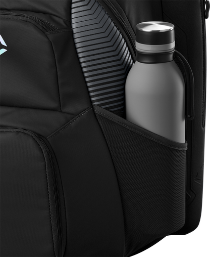 A close-up of the EvoShield Tone Set Backpack (WB57304) by EvoShield shows its water-resistant side pocket holding a gray water bottle, with a striped item, possibly a laptop or tablet, visible beside it.