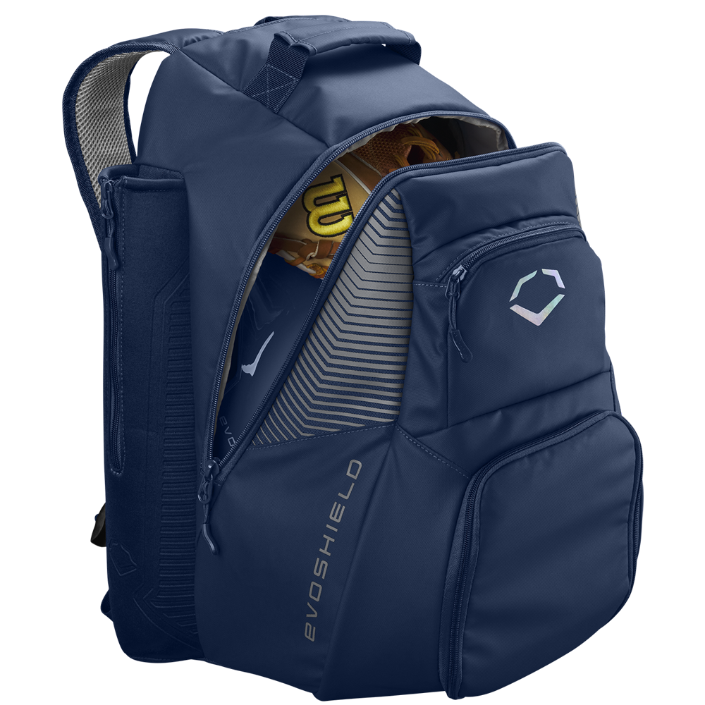 The EvoShield Tone Set Backpack: WB57304 is a navy blue, water-resistant backpack with bat sleeves, multiple zippered pockets, padded shoulder straps, and a partially open main compartment showing a yellow Wilson baseball glove.