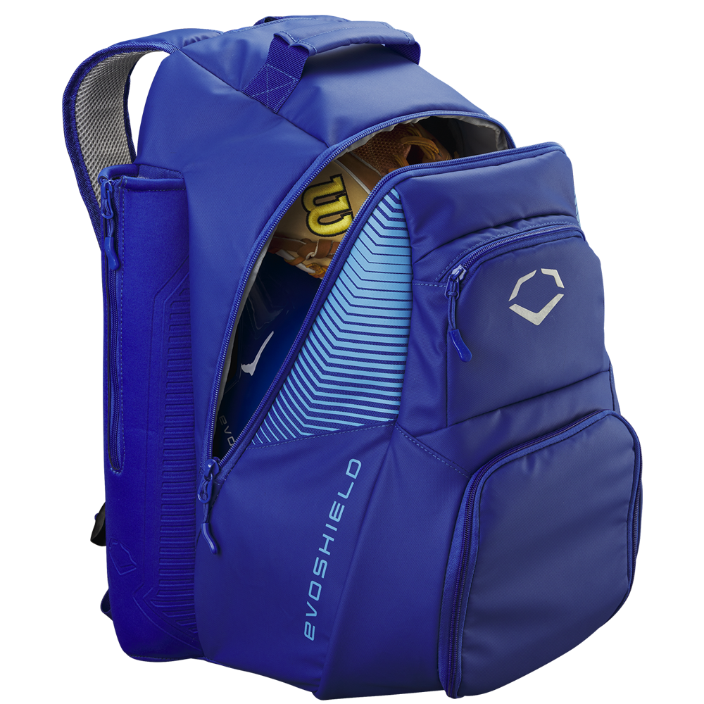 The EvoShield Tone Set Backpack: WB57304 in blue is shown unzipped with a yellow baseball glove inside. It features multiple compartments, bat sleeves, and displays the EvoShield logo and brand name on the front.