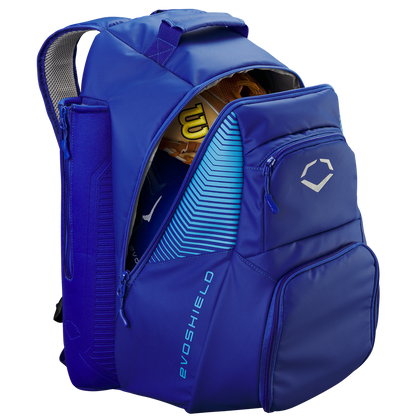The EvoShield Tone Set Backpack: WB57304 in blue is shown unzipped with a yellow baseball glove inside. It features multiple compartments, bat sleeves, and displays the EvoShield logo and brand name on the front.
