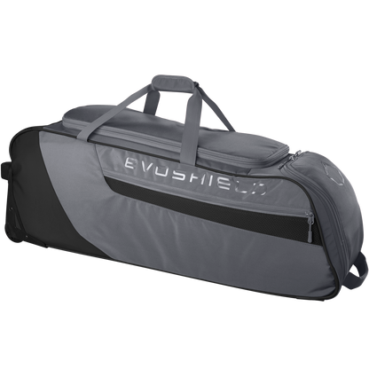 The EvoShield Takeover Wheeled Bag (WB57572) is a large gray baseball gear bag with black accents, side pocket, bat sleeves, carrying handles, and wheels for easy transport, shown against a plain white background.