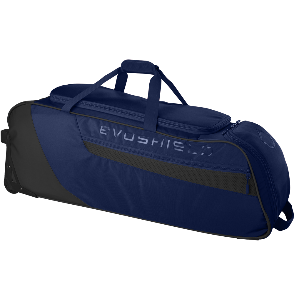The EvoShield Takeover Wheeled Bag (WB57572) is a large, navy blue and black bag with EVOSHIELD branding, bat sleeves, a top handle, side pocket, and wheels for easy baseball gear transport.