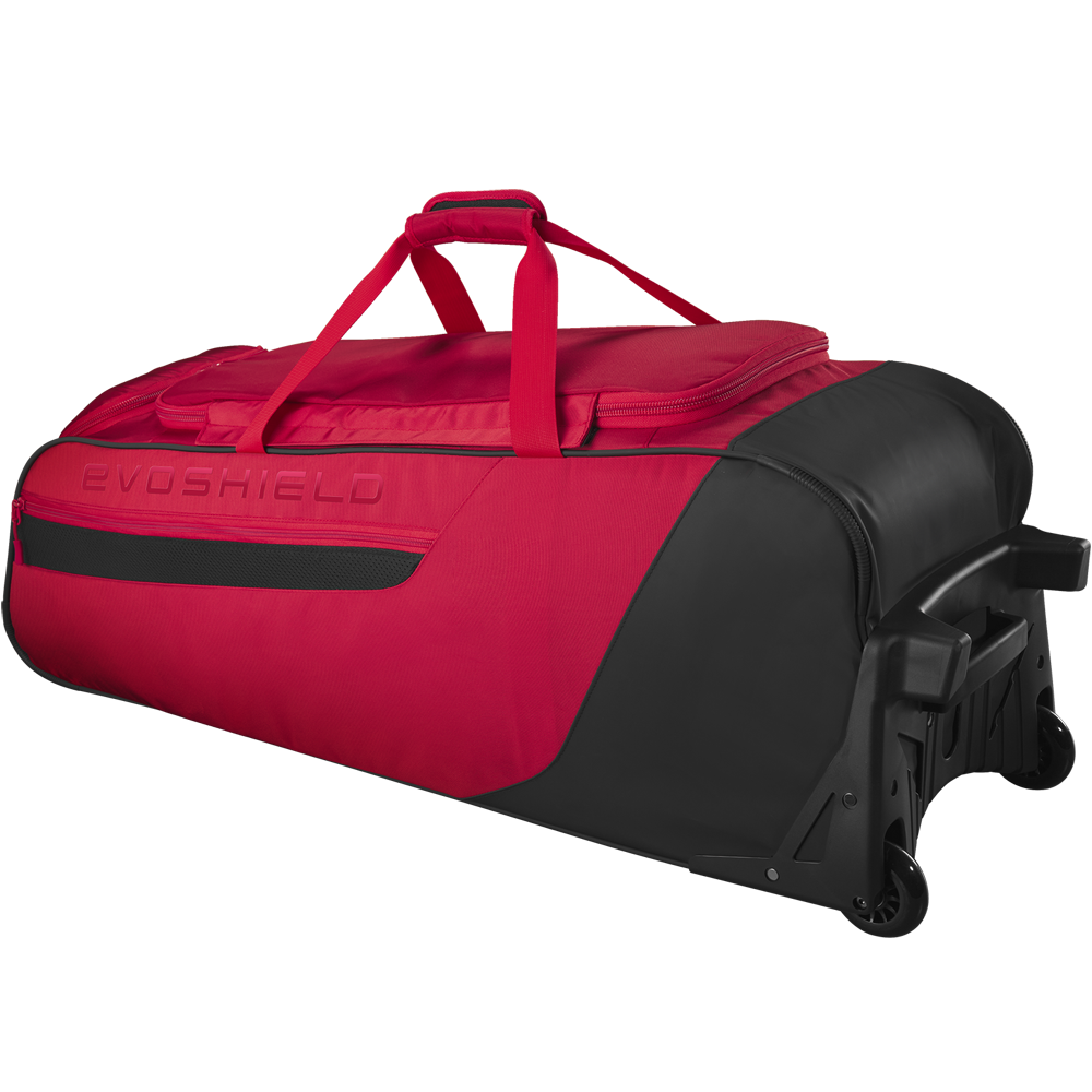 The EvoShield Takeover Wheeled Bag (WB57572) is a large red and black gear bag with sturdy wheels, a top handle, and bat sleeves—ideal for baseball gear. EvoShield branding is embossed on the side.