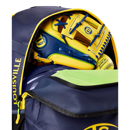 A close-up of a partially unzipped navy and yellow Louisville Slugger Savannah Bananas Powerized Stick Pack Backpack (WB57636) shows a yellow and blue Wilson baseball glove and a yellow softball inside.