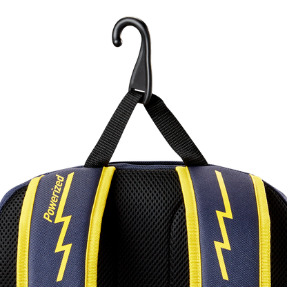 Close-up of the Louisville Slugger Savannah Bananas Powerized Stick Pack Backpack (WB57636), with blue and yellow lightning bolt straps, "Powerized" printed on a strap, hanging from a black hook by its loop.