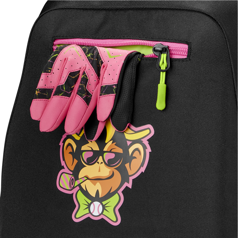 A pair of pink and black sports gloves is tucked into the zipper pocket of a Louisville Slugger Party Animals Powerized Stick Pack Backpack, which features a colorful cartoon monkey with glasses, bow tie, and bubble pipe.