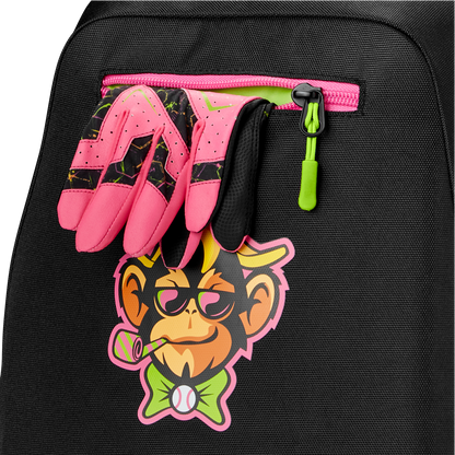 A pair of pink and black sports gloves is tucked into the zipper pocket of a Louisville Slugger Party Animals Powerized Stick Pack Backpack, which features a colorful cartoon monkey with glasses, bow tie, and bubble pipe.