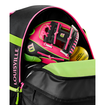 A close-up of an open Louisville Slugger Party Animals Powerized Stick Pack Backpack reveals a neon pink and black Wilson softball glove and two yellow softballs inside its main compartment.