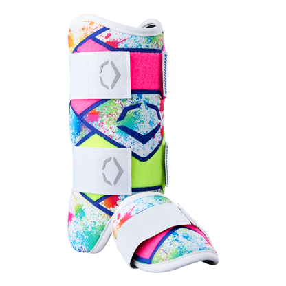 The EvoShield SRZ-2 Youth Batter's Leg Guard by EvoShield features a vibrant splatter pattern in pink, blue, green, and yellow with white adjustable straps and sole—engineered for comfort much like an ergonomic medical walking boot.