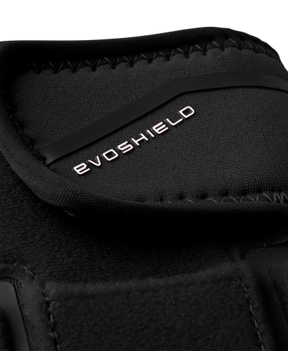 Close-up of the EvoShield Shorty Sliding Mitt 2.0 (WB57728) in black, showing white EvoShield branding on the strap with visible texture and stitching details for baseball hand protection.
