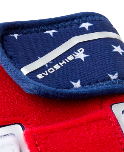 A close-up of the EvoShield Shorty Sliding Mitt 2.0: WB57728, a red and blue mitt by EvoShield designed for superior baseball hand protection.