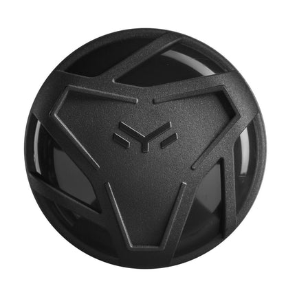 A black, round object with a raised, geometric pattern like a stylized animal face—reminiscent of the DeMarini 2024 The Goods (-5) 2 5/8" USSSA Baseball Bat (WBD2471010)—glossy surface and matte textured lines, viewed from above.