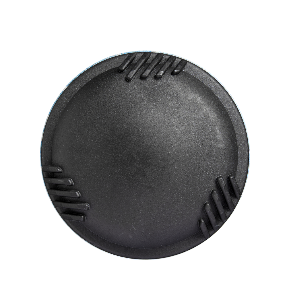 A round, black camera lens cap with three ridged grips evenly spaced around the edge, viewed from above on a white background—reflecting the precision engineering of the 2025 DeMarini The Goods (-10) USSSA Baseball Bat.