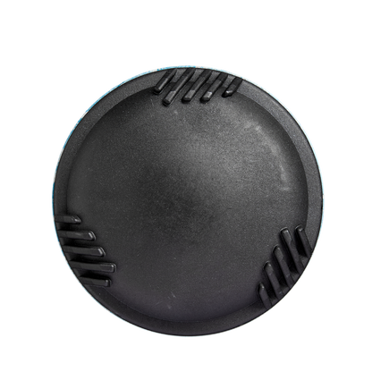 A round, black camera lens cap with three ridged grips evenly spaced around the edge, viewed from above on a white background—reflecting the precision engineering of the 2025 DeMarini The Goods (-10) USSSA Baseball Bat.