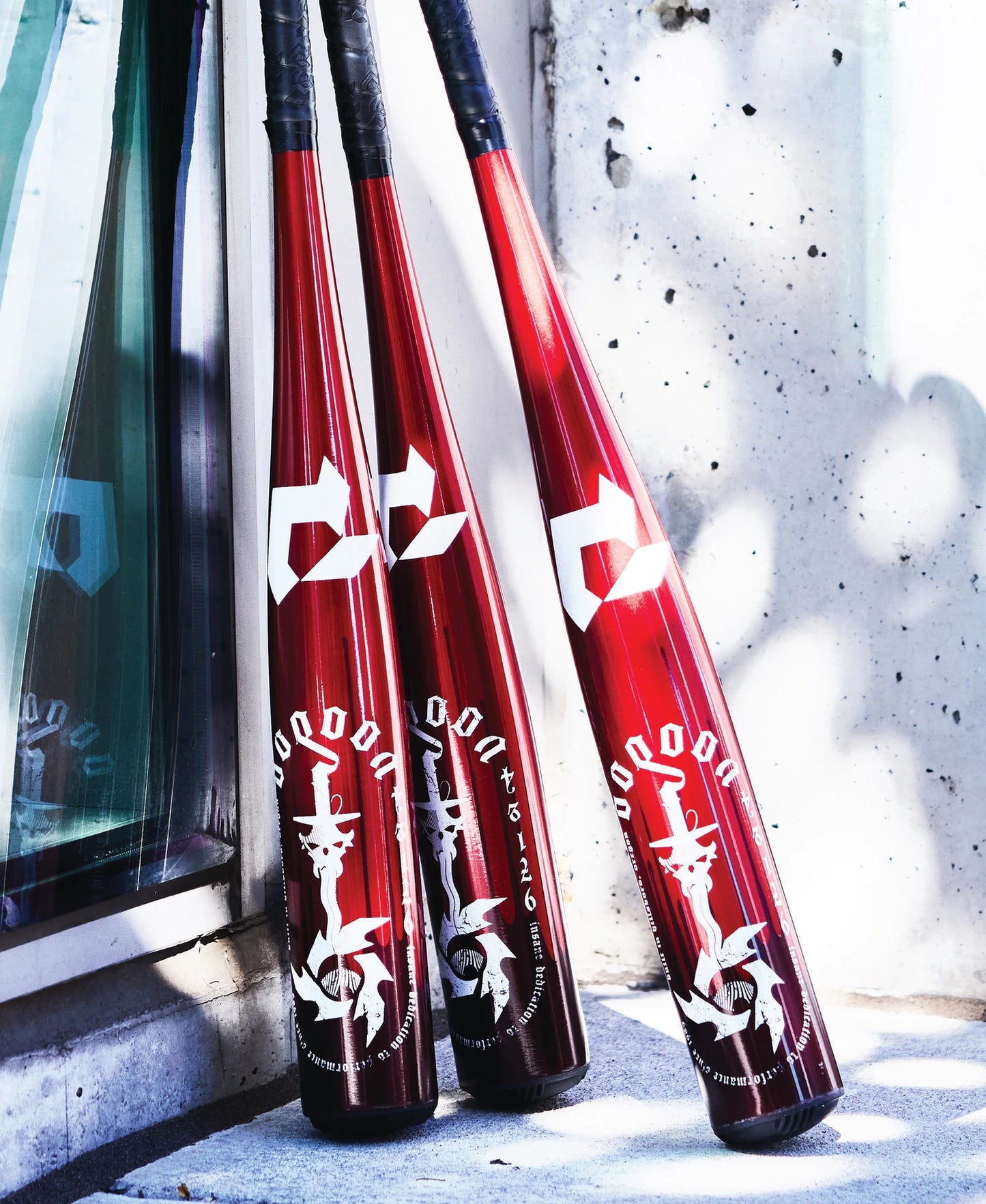 A group of baseball bats, including the 2025 DeMarini Voodoo One (-8) USSSA Baseball Bat (WBD2539010) by DeMarini, featuring a powerful X14 Alloy Barrel for USSSA play.
