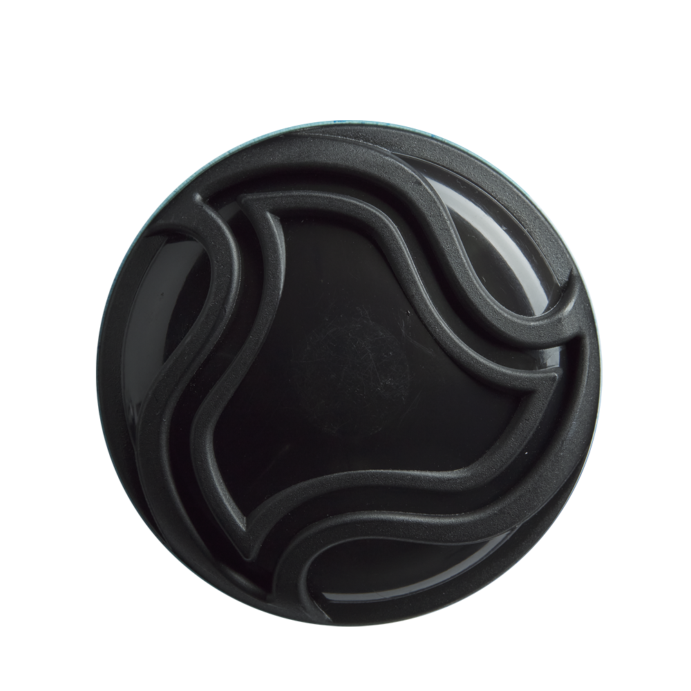 A round black container lid with raised, wavy lines—echoing the sleek X14 Alloy Barrel design of the DeMarini 2026 Omega (-3) BBCOR Baseball Bat: WBD2586010—is viewed from above against a white background.