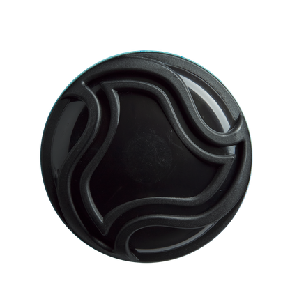 A round black container lid with raised, wavy lines—echoing the sleek X14 Alloy Barrel design of the DeMarini 2026 Omega (-3) BBCOR Baseball Bat: WBD2586010—is viewed from above against a white background.