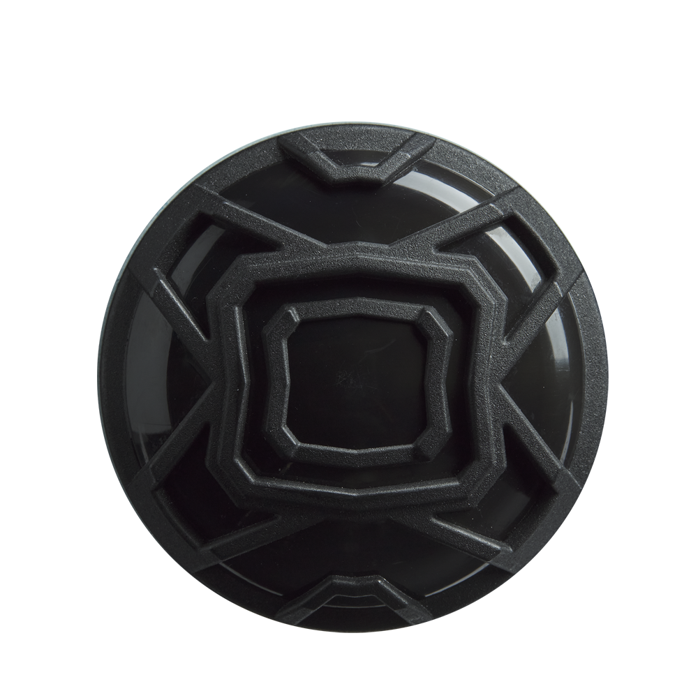 A black, circular object with a geometric raised angular pattern—resembling the end cap of the DeMarini The Goods (-3) BBCOR Baseball Bat (2026, WBD2588010)—is viewed from above against a plain white background.