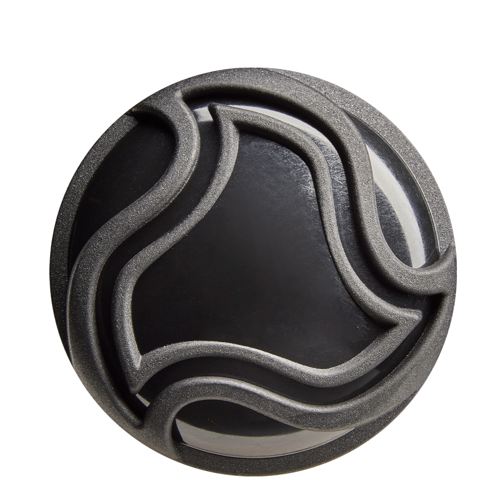 A round black object with raised, wavy lines in an abstract pattern—echoing the precision of the DeMarini The Goods (-10) 2 5/8" USA Baseball Bat: WBD2601010—viewed from above on a light background.