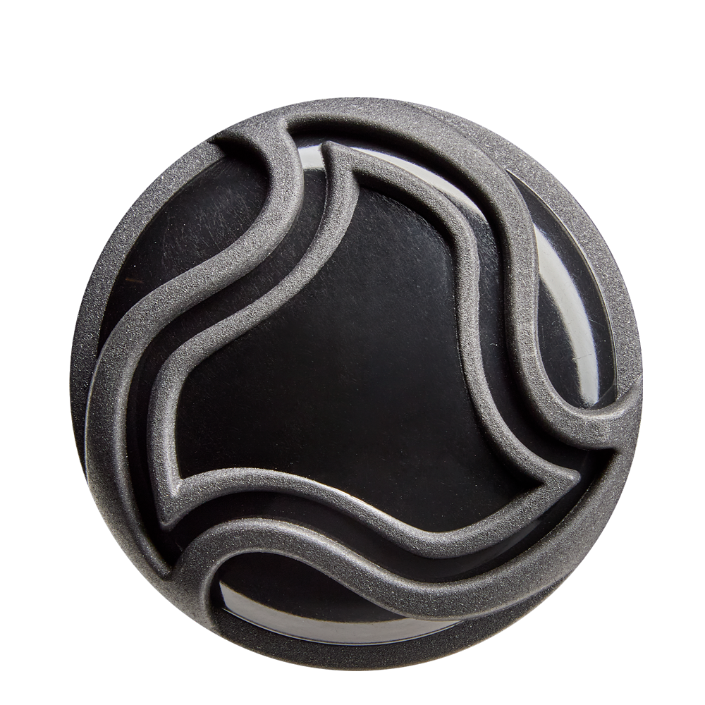 A round, black object with raised, wavy silver lines forming an abstract pattern—evoking the X14 Alloy of the 2026 DeMarini Voodoo One (-5) 2 5/8" USA Baseball Bat (WBD2603010)—is shown against a white background.