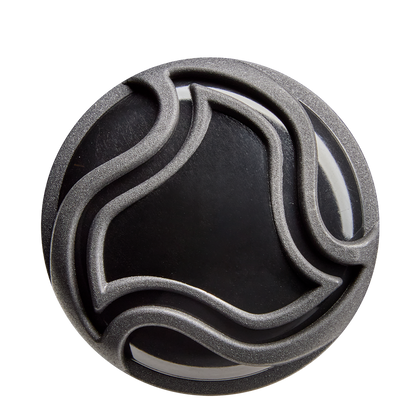 A round, black object with raised, wavy silver lines forming an abstract pattern—evoking the X14 Alloy of the 2026 DeMarini Voodoo One (-5) 2 5/8" USA Baseball Bat (WBD2603010)—is shown against a white background.