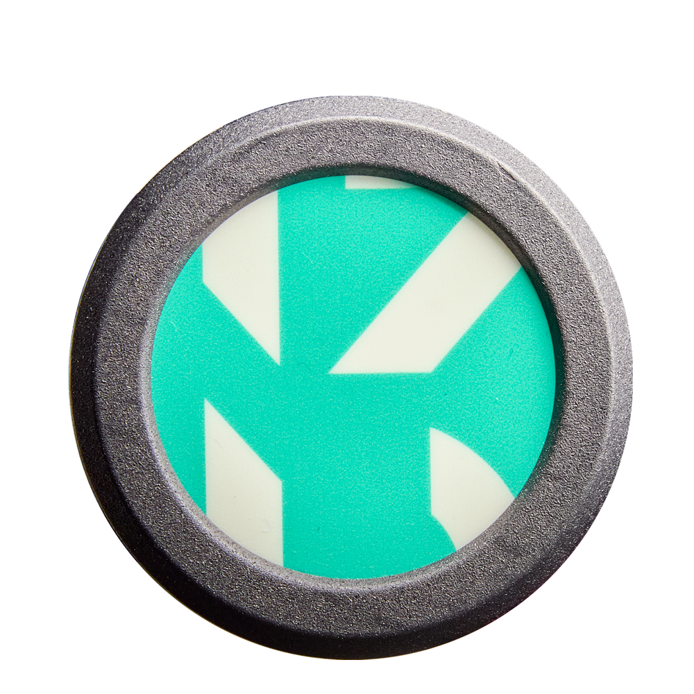 A round metal object frames a teal and white geometric design with bold, angular lines—resembling the eye-catching patterns found on the DeMarini CF FE (-11) Fastpitch Softball Bat: WBD2630010 (DEMO).