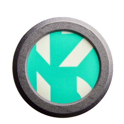 A round metal object frames a teal and white geometric design with bold, angular lines—resembling the eye-catching patterns found on the DeMarini CF FE (-11) Fastpitch Softball Bat: WBD2630010 (DEMO).