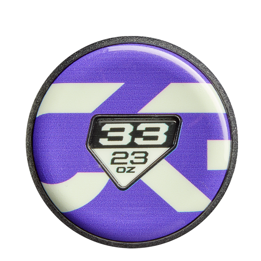 Celebrate your favorite bat with a round pin featuring a purple and white background and center badge displaying 38 above 23 oz—perfect for fans of the DeMarini CF FE (-10) Fastpitch Softball Bat: WBD2631010.