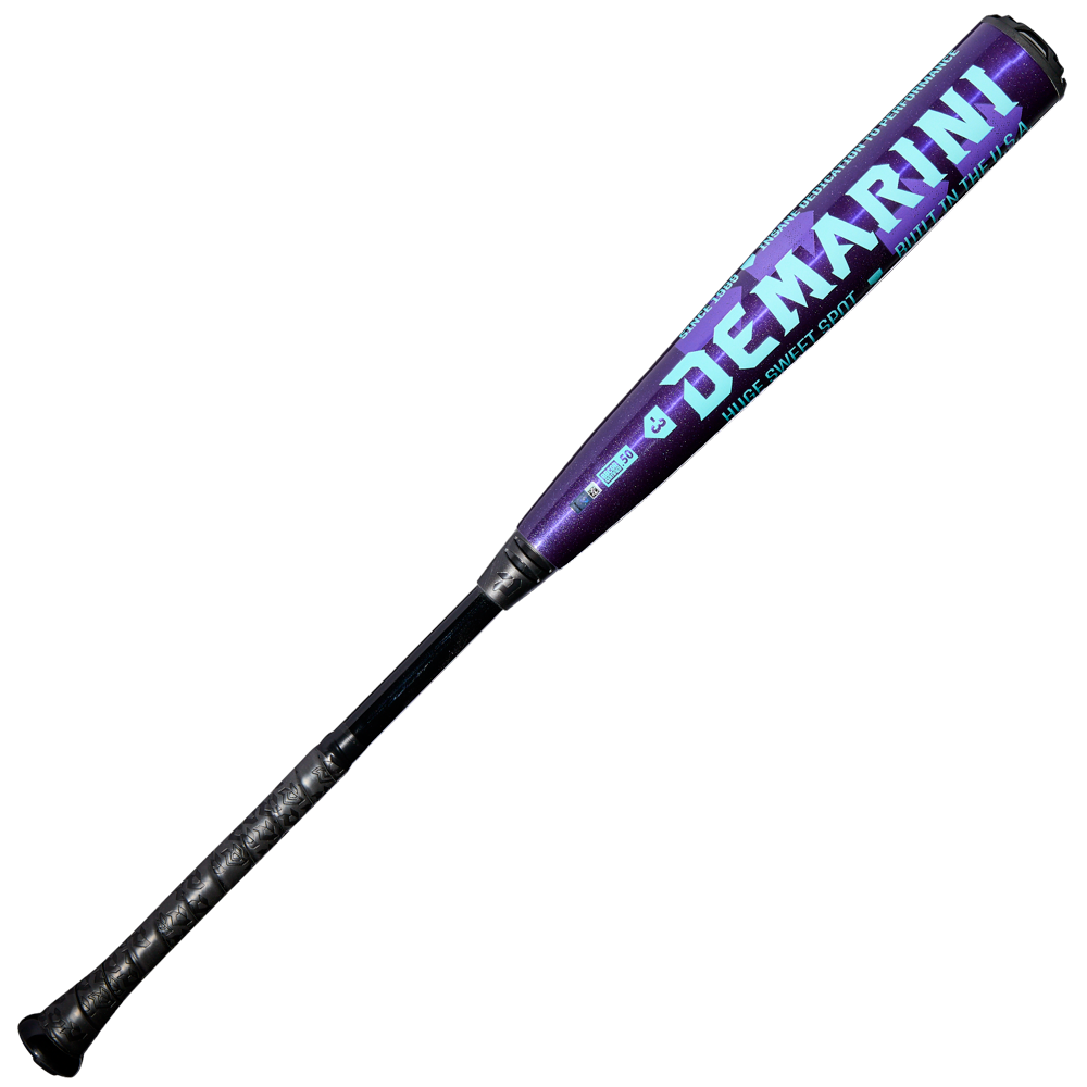 The 2026 DeMarini The Goods Royal Purple (-3) BBCOR Baseball Bat (WBD2634010) features a black handle, royal purple barrel, and turquoise branding.