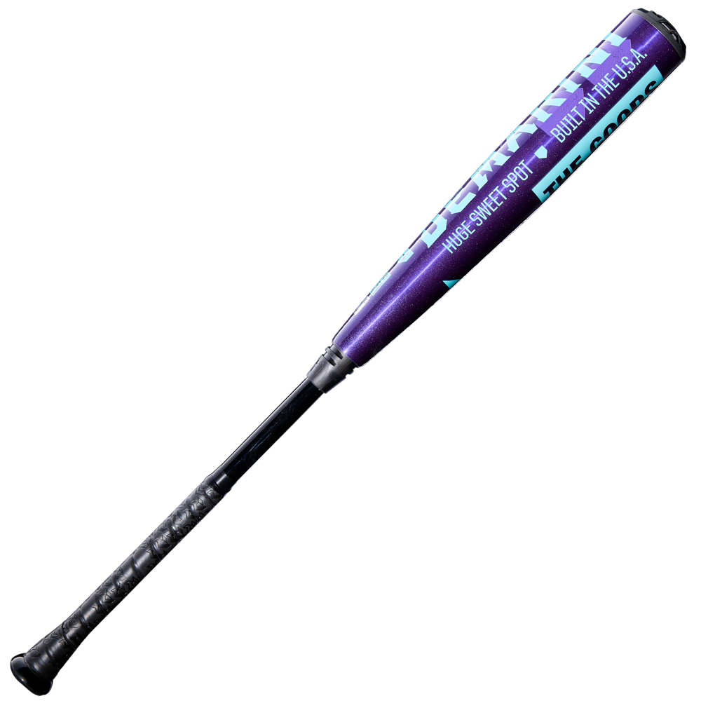 The 2026 DeMarini The Goods Royal Purple (-3) BBCOR Baseball Bat (WBD2634010) features a royal purple and black design with teal and white text, a black grip handle, and “BUILT IN THE USA” near the barrel.