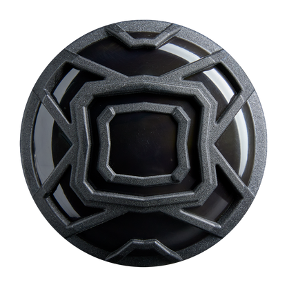 A black circular object with a maze-like, metallic gray pattern, echoing the precision of the DeMarini 2026 The Goods Gunmetal (-3) BBCOR Baseball Bat (WBD2650010), is shown from above on a white background.