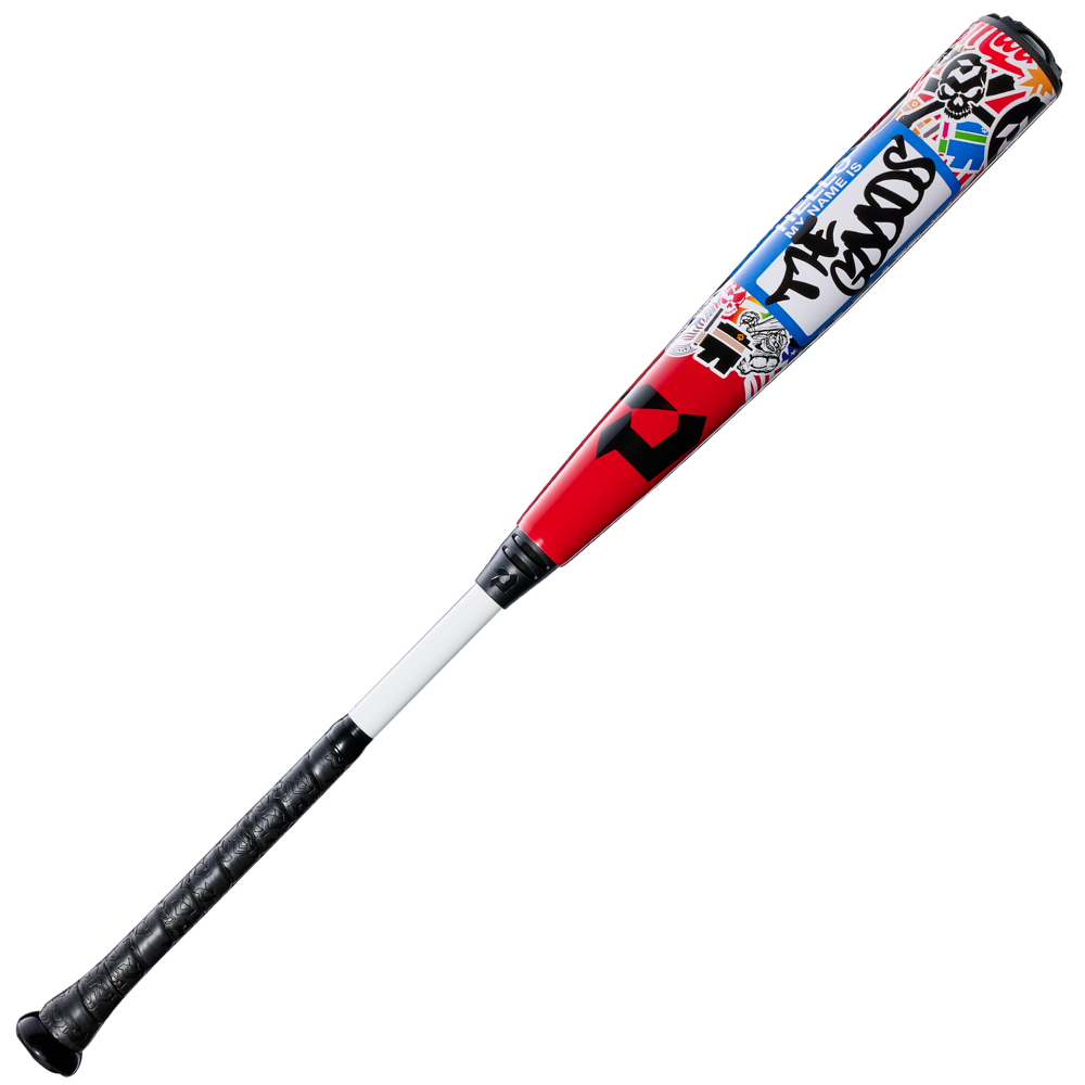 A DeMarini 2026 The Goods Sticker Bomb (-3) BBCOR Baseball Bat (WBD2653010) with a black handle, white middle, and red/blue barrel featuring vibrant graffiti-style graphics.