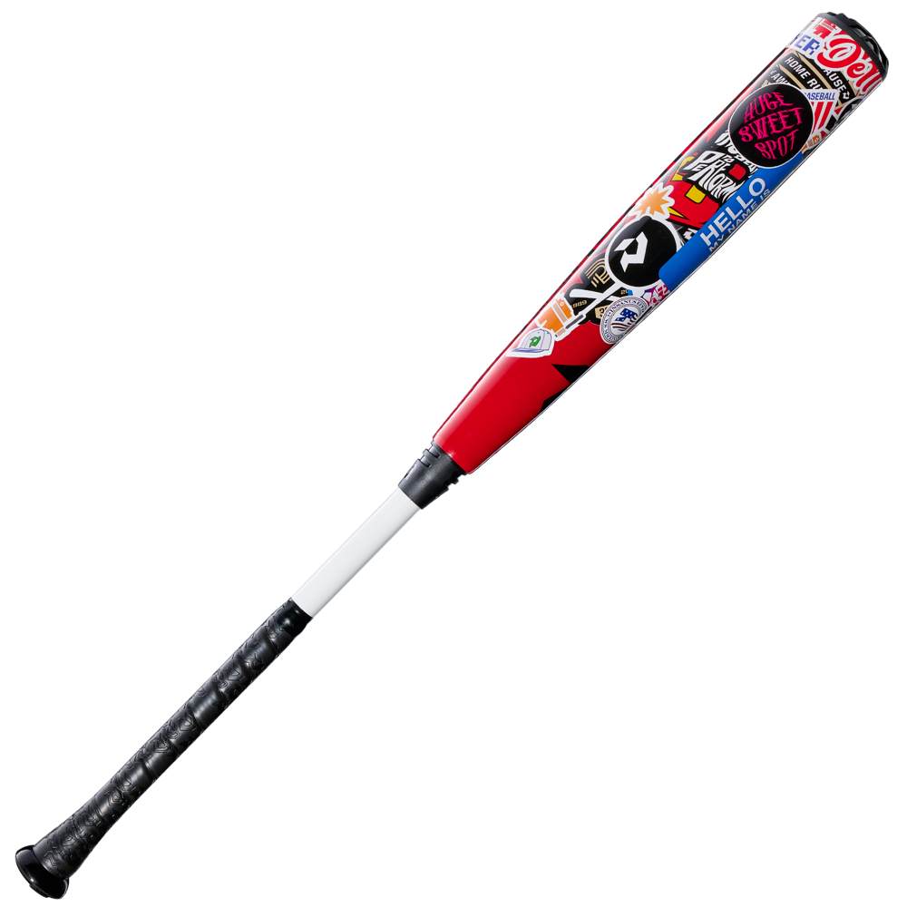 A 2026 DeMarini The Goods Sticker Bomb (-3) BBCOR Baseball Bat (WBD2653010) by DeMarini, featuring a black handle, white grip, and red barrel with colorful sticker designs, displayed on a plain white background.