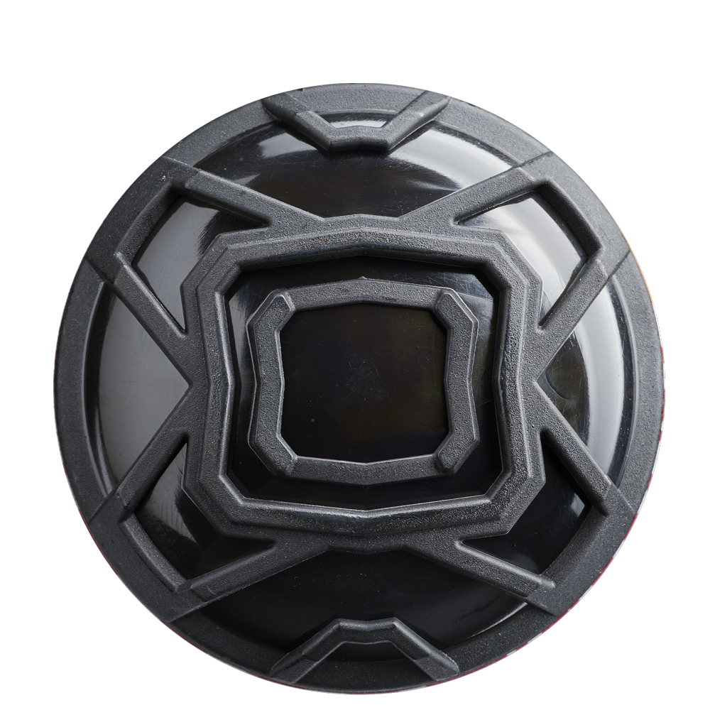 A black circular object with a black center, echoing the sleek design of the 2026 DeMarini The Goods Sticker Bomb (-3) BBCOR Baseball Bat: WBD2653010.