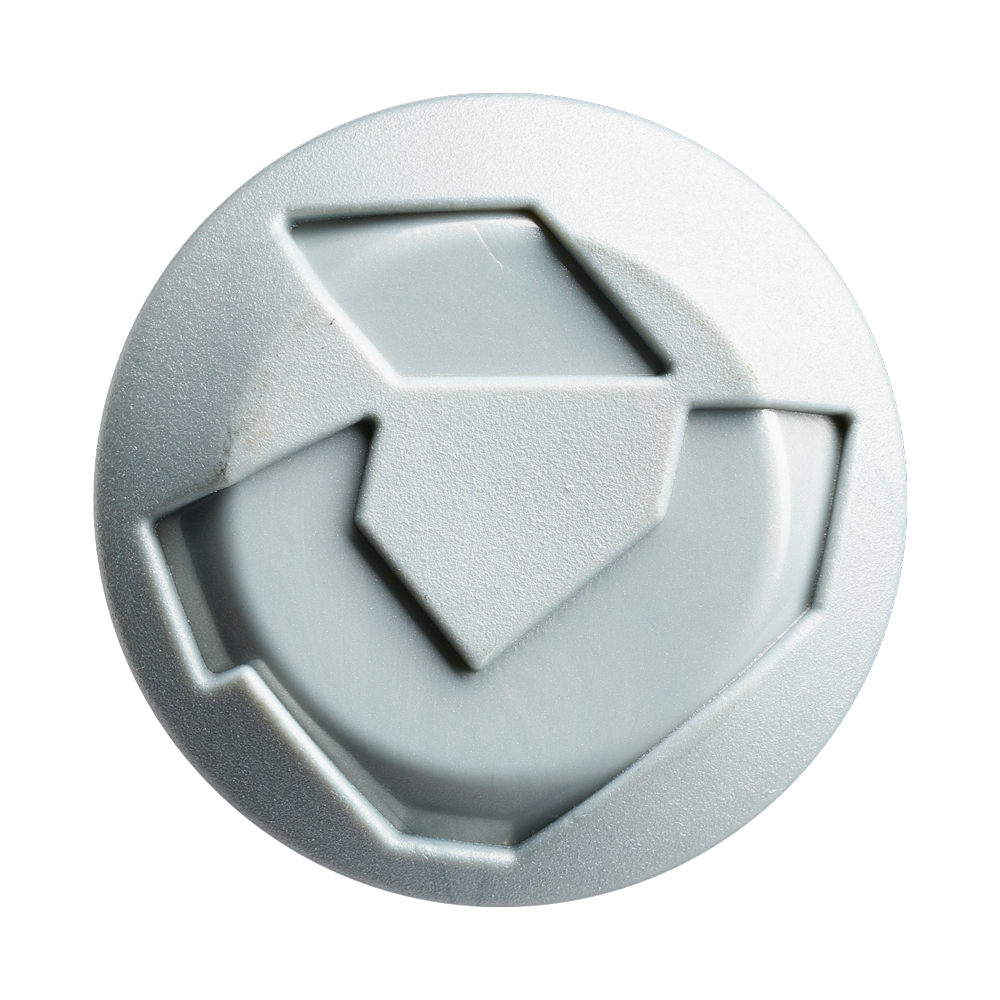 A close-up of a round, light gray button with a raised recycling symbol, evoking the eco-conscious design found in the 2027 DeMarini Stadium 13" Endload NSA USSSA Slowpitch Softball Bat (WBD2682010) by DeMarini. Plain white background.