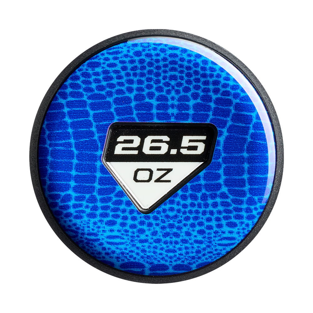 A round, blue object with a textured pattern features "26.5 OZ" in bold white on a black and white shield label, echoing the DeMarini Jeremy Yates Twisted Mistress 13" Endload Slowpitch Softball Bat (WBD2684010) design.