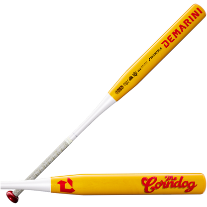 Two yellow and white DeMarini slowpitch softball bats feature bold red text—one displaying the DeMarini name on the barrel, while the other showcases The Corndog logo. Both bats have a Pro Maple barrel construction, striking red accents, and a white handle wrapped with grip tape. The DeMarini Corndog Wood Composite All Association Slowpitch Softball Bat (WBD2699010) offers premium durability and high performance for your next game.
