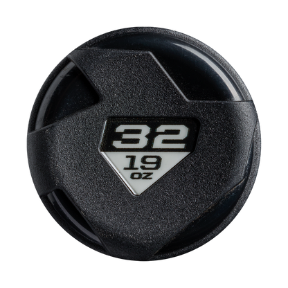 A round black object with a white triangular label showing 32 and 19 OZ, featuring a textured, angular design like the barrel of the DeMarini Zenith (-13) Fastpitch Softball Bat (WBD2732010) by DeMarini.