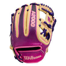 The Wilson A2000 1720SS 11.5″ Baseball Glove: WBG0009401RT115 by Wilson showcases a stylish blend of tan, purple, and pink, highlighted by bold purple laces. With vibrant pink “A2000” lettering on the back and “Wilson” on the wrist strap, this infielders glove is ideal for players who want both standout style and top-tier performance.