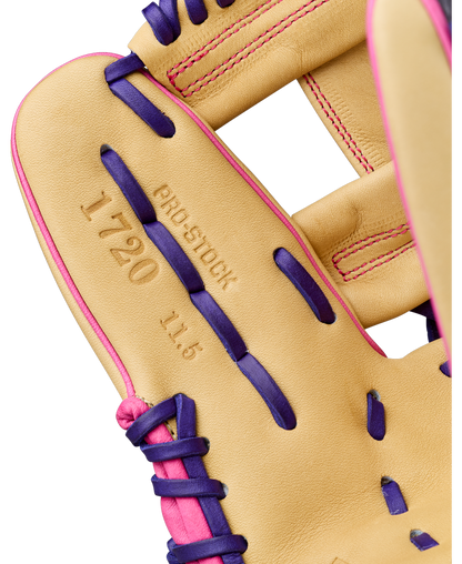 Close-up of a tan Wilson A2000 1720SS 11.5″ Baseball Glove: WBG0009401RT115, accented with purple laces and pink stitching, highlighting the embossed text “1720 PRO STOCK 11.5” on the leather—a premium infield glove from Wilson engineered for precise fielding.