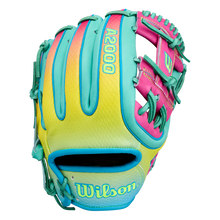 A vibrant Wilson A2000 1727SS 11.5″ Baseball Glove (WBG0009501RT1175) by Wilson, crafted with yellow, teal, and pink leather, accented by teal laces and SuperSnakeSkin detailing, is displayed palm side down on a white background.