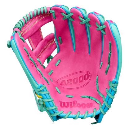 A Wilson A2000 1727SS 11.5″ Baseball Glove (model WBG0009501RT1175) by Wilson is displayed open with the palm side visible, showcasing its pink color with teal lacing and accents and SuperSnakeSkin construction against a white background.