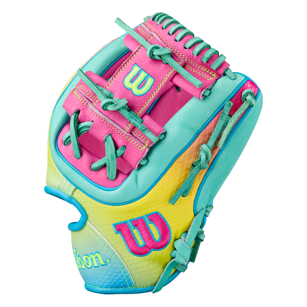 The Wilson A2000 1727SS 11.5″ Baseball Glove (WBG0009501RT1175) by Wilson showcases vibrant pink, yellow, teal, and light blue accents, bold stitching, advanced SuperSnakeSkin backing for lightweight durability, and is adorned with the signature Wilson W logo on the thumb and wrist area.