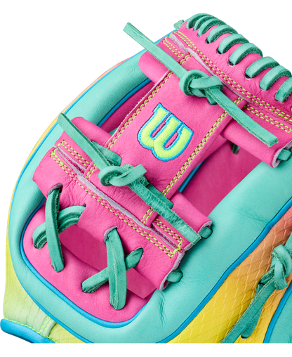 A close-up of the Wilson A2000 1727SS 11.5″ Baseball Glove (WBG0009501RT1175) by Wilson, showcasing its vibrant pink, teal, yellow, and green leather with detailed stitching, SuperSnakeSkin accents, and a prominently embroidered W logo.