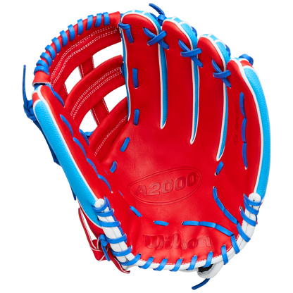 A vibrant red Wilson A2000 PCA4 12.5″ Pete Crow-Armstrong GM baseball glove, accented with blue and white laces and featuring the embossed A2000 text in the palm area.