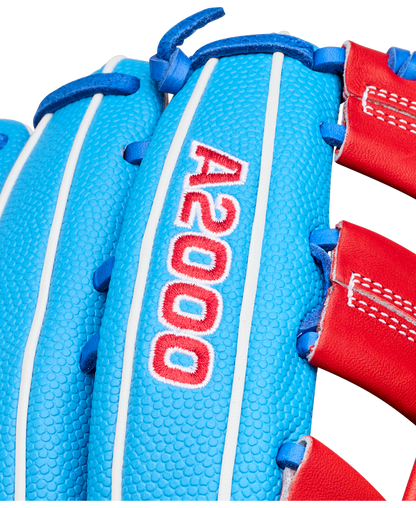 Close-up of a blue and red Wilson A2000 PCA4 12.5″ Pete Crow-Armstrong GM Baseball Glove (WBG0009701) featuring white stitching and the number A2000 embroidered in red and white.