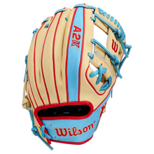 The Wilson A2K 1786 11.5″ Baseball Glove (WBG0010101RT115) by Wilson is showcased against a plain white background, featuring a beige and light blue design crafted from Pro Stock Select leather with striking red stitching and accents.